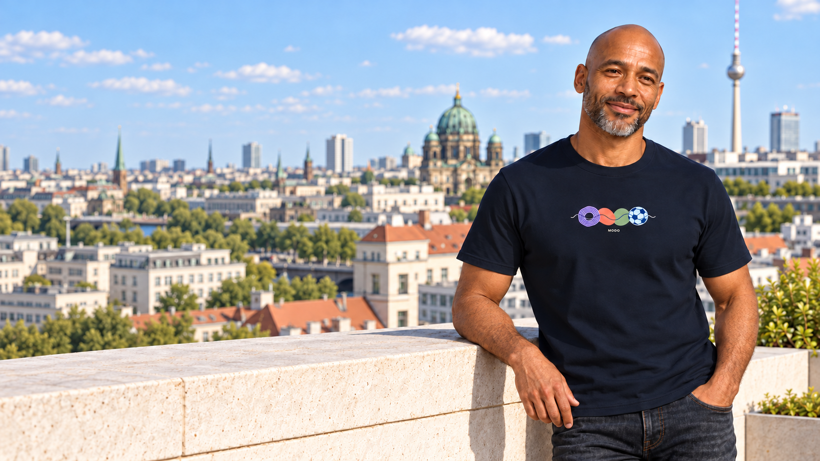Model wearing an Overlap Play navy graphic T-shirt
